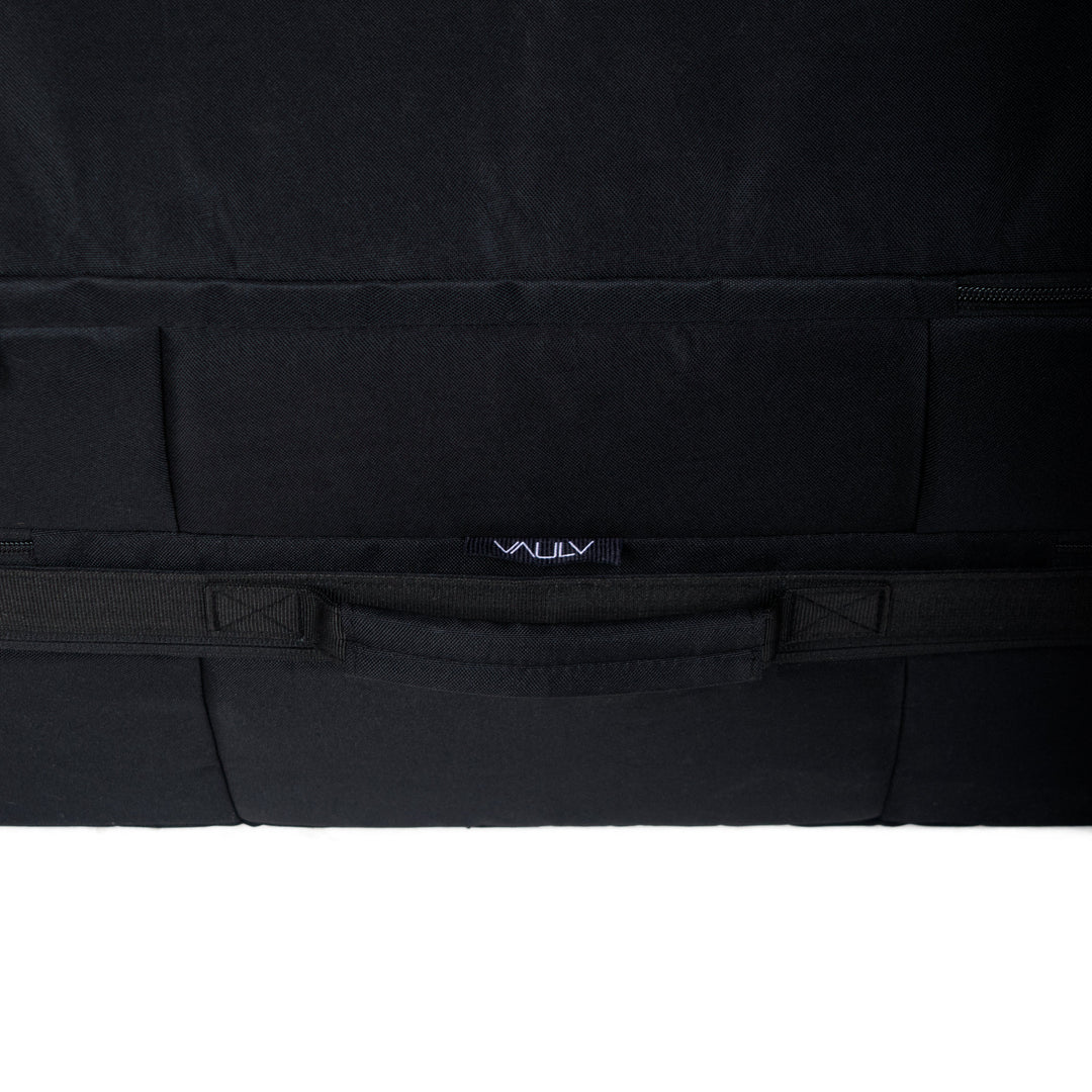 Black rectangular luggage protector with a VAULV brand logo on a white background