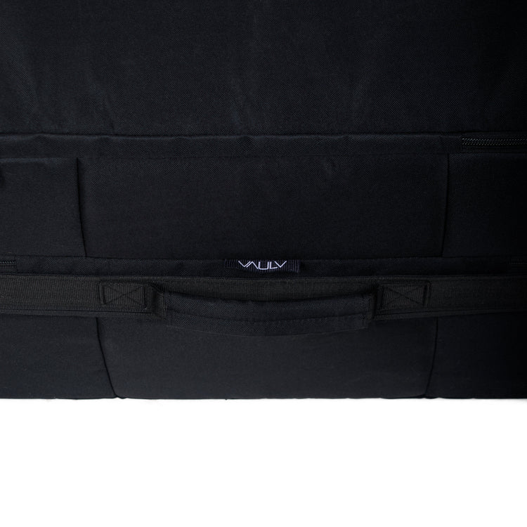 Black rectangular luggage protector with a VAULV brand logo on a white background